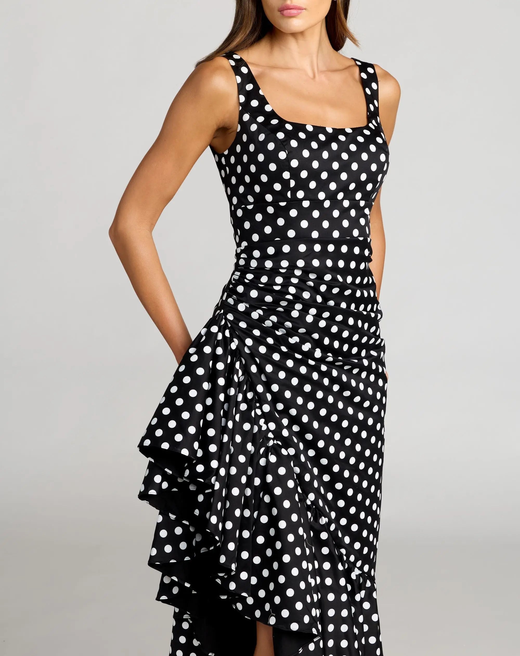 Black Sleeveless Polka Dot Midi Dress With Ruffled Hem - Image 2